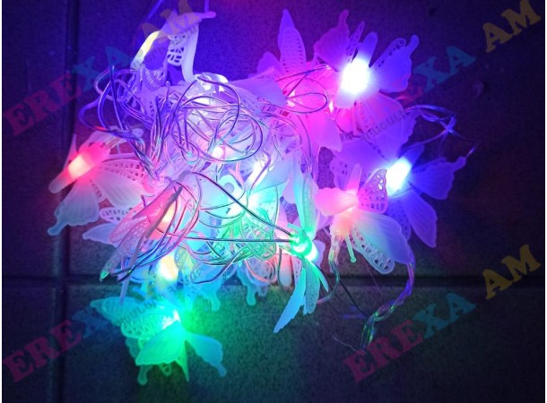 Տոնածառի լույս թիթեռնիկներով Տոնածառի լույս թիթեռնիկներով